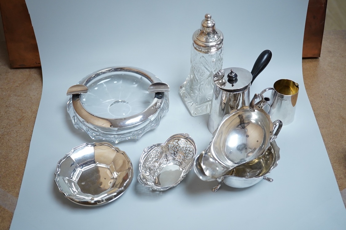 Sundry silver including two George V silver sauce boats, a silver café au lait pot, a small silver cream jug, three small silver dishes, a silver mounted glass sugar sifter and a silver mounted glass ashtray.